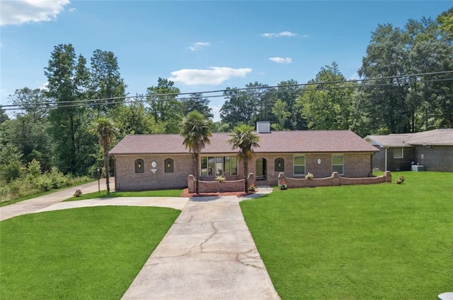 12 Windsor Way, Newnan, GA 30263 - single story home featuring driveway, a front lawn, and brick siding