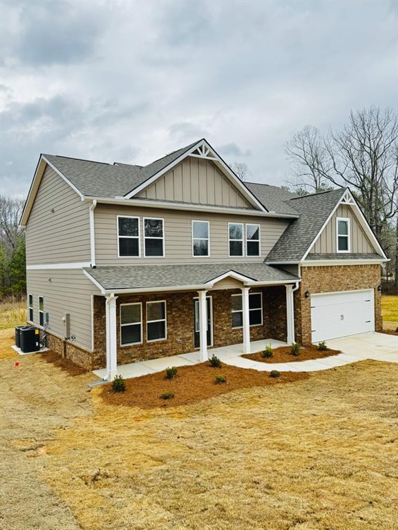 61 Observation Way, Dallas, GA 30132 - craftsman-style home featuring board and batten siding, a shingled roof, concrete driveway, cooling unit, and an attached garage