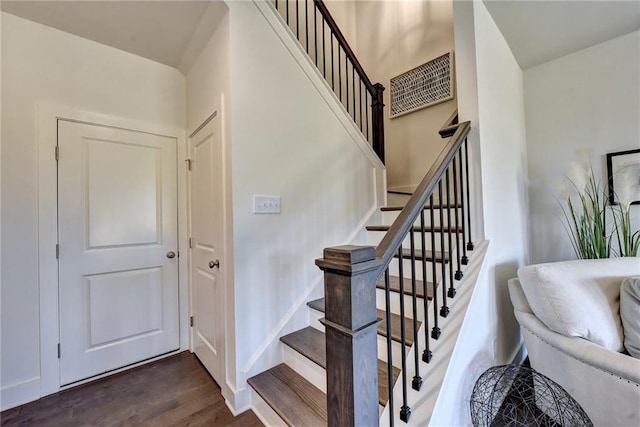 staircase featuring hardwood / wood-style flooring