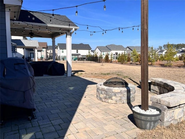 view of patio / terrace with a fire pit