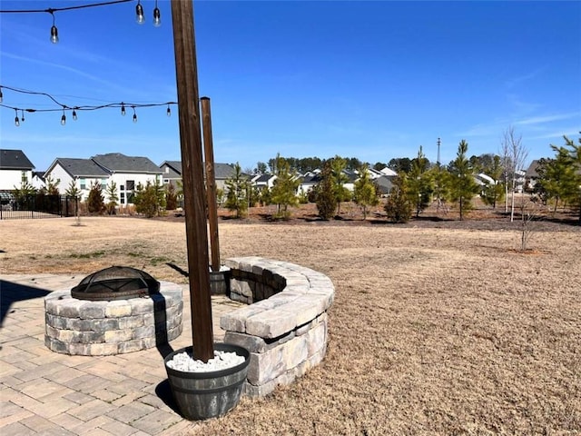 view of yard featuring a patio area and a fire pit