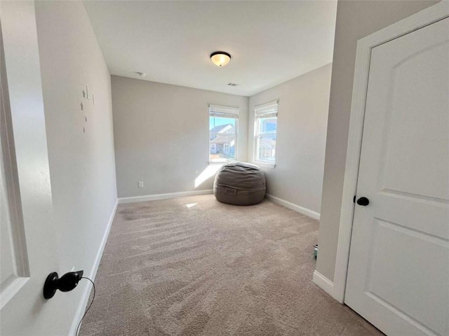 sitting room with light colored carpet