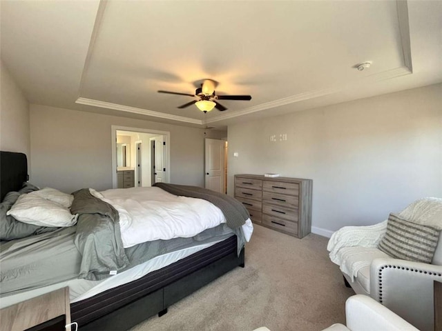 bedroom featuring light carpet, ceiling fan, and a tray ceiling