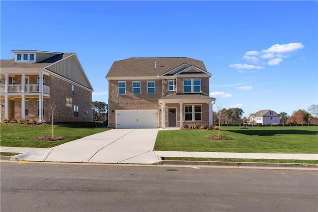 view of front of home with a garage and a front lawn