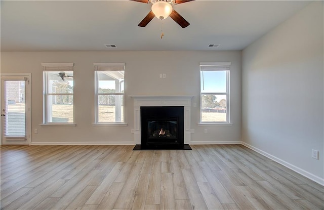 unfurnished living room with light hardwood / wood-style floors and ceiling fan