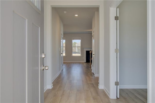 hall with light hardwood / wood-style floors