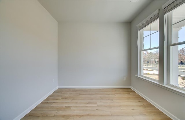 spare room featuring light wood-type flooring