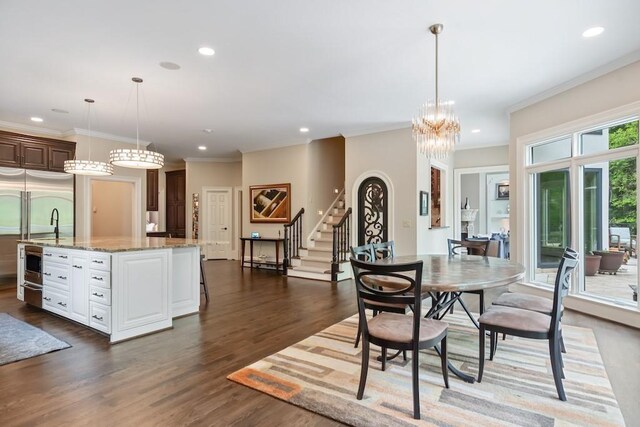 dining area featuring a wealth of natural light, dark wood-type flooring, and ornamental molding