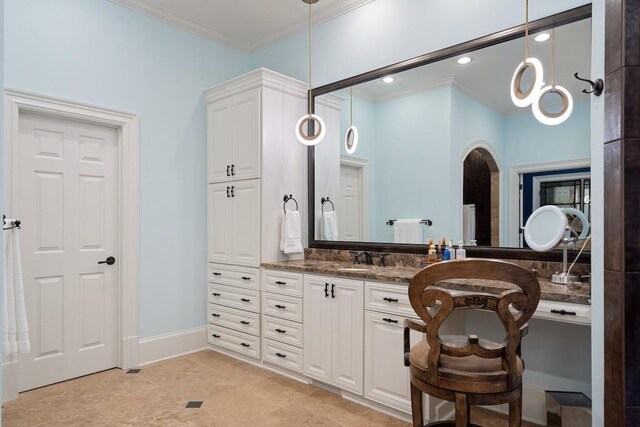 bathroom featuring vanity and crown molding