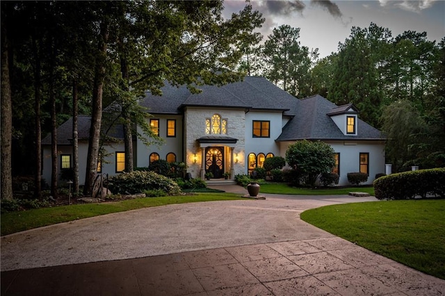 view of front of home with a yard