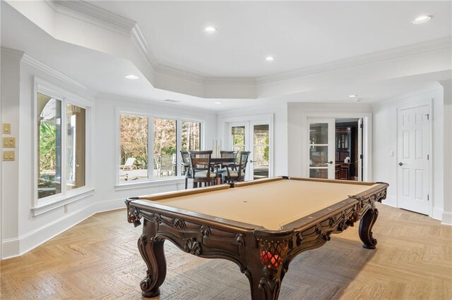 rec room featuring a raised ceiling, a wealth of natural light, ornamental molding, and billiards