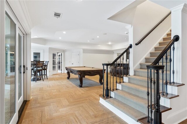 rec room with light parquet floors, crown molding, billiards, and french doors