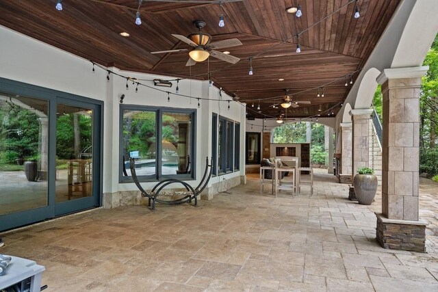 view of patio featuring french doors and ceiling fan