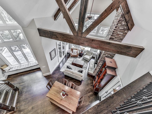 5039 Towne Lake Hls N, Woodstock, GA 30189 - living room with high vaulted ceiling, plenty of natural light, a ceiling fan, wood finished floors, and beam ceiling