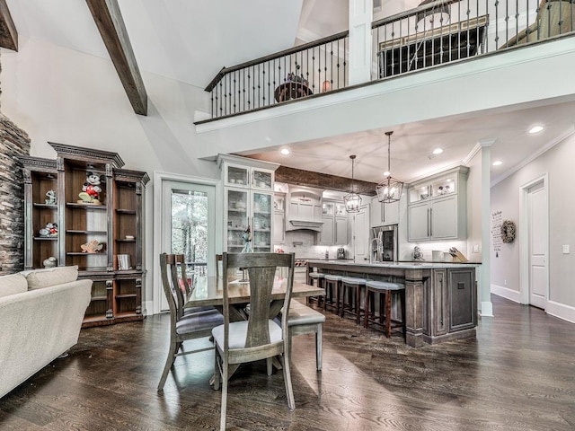 5039 Towne Lake Hls N, Woodstock, GA 30189 - dining area featuring a high ceiling, dark wood-style flooring, baseboards, beam ceiling, and recessed lighting