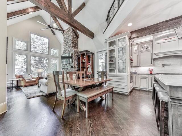 5039 Towne Lake Hls N, Woodstock, GA 30189 - dining room with high vaulted ceiling, ceiling fan, beamed ceiling, dark wood-type flooring, and recessed lighting