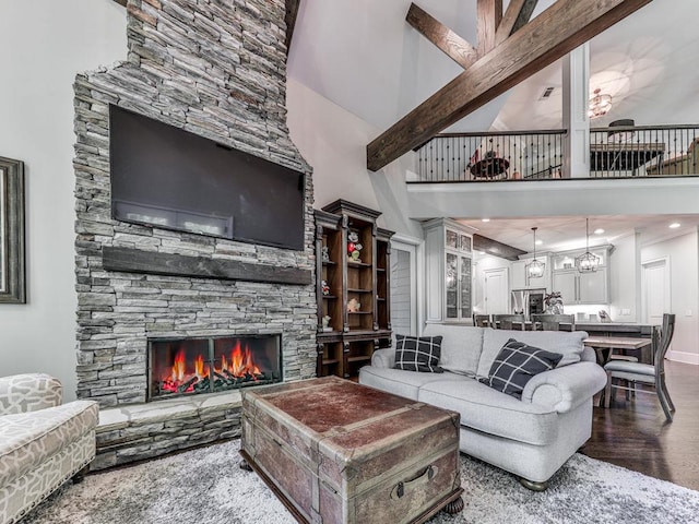 5039 Towne Lake Hls N, Woodstock, GA 30189 - living room with a towering ceiling, wood finished floors, and a fireplace