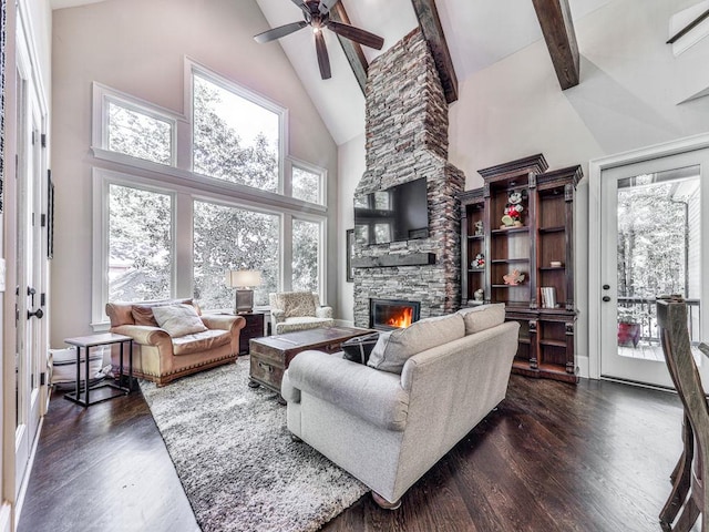 5039 Towne Lake Hls N, Woodstock, GA 30189 - living area featuring high vaulted ceiling, a fireplace, wood finished floors, ceiling fan, and beam ceiling