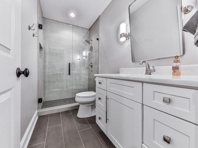 5039 Towne Lake Hls N, Woodstock, GA 30189 - bathroom with tile patterned floors, toilet, a shower stall, baseboards, and vanity