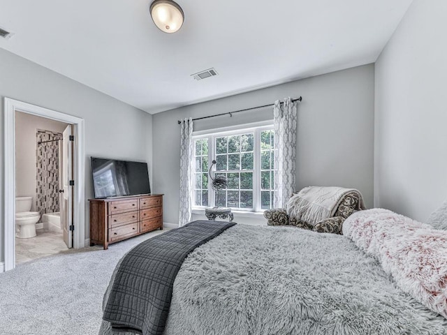 5039 Towne Lake Hls N, Woodstock, GA 30189 - carpeted bedroom featuring connected bathroom and baseboards