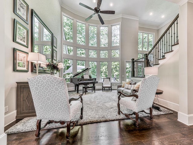 5039 Towne Lake Hls N, Woodstock, GA 30189 - living area with ornamental molding, baseboards, a ceiling fan, recessed lighting, and a high ceiling