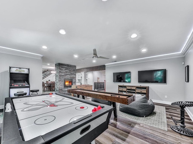 5039 Towne Lake Hls N, Woodstock, GA 30189 - game room featuring crown molding, wood finished floors, baseboards, ceiling fan, and recessed lighting