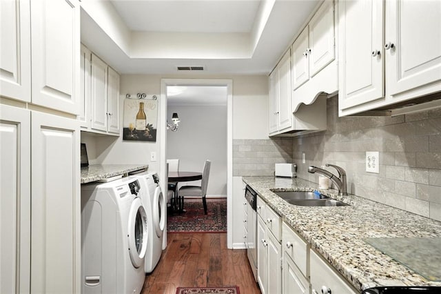 6851 Roswell Rd Unit F5, Sandy Springs, GA 30328 - laundry room featuring washing machine and dryer, dark wood-style floors, and cabinet space