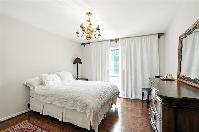 6851 Roswell Rd Unit F5, Sandy Springs, GA 30328 - bedroom featuring a chandelier and dark wood-type flooring