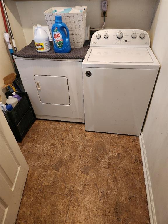 clothes washing area featuring washing machine and dryer