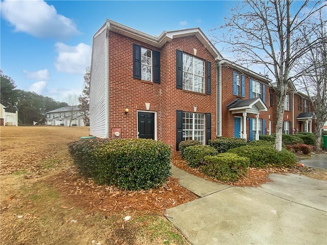 view of front of house featuring brick siding