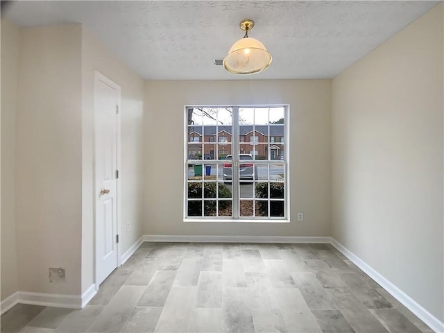 interior space featuring baseboards