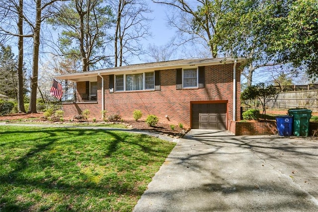 view of front of home with brick siding, a front yard, concrete driveway, and an attached garage