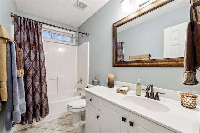 full bath featuring visible vents, shower / bath combo with shower curtain, a textured ceiling, vanity, and tile patterned floors