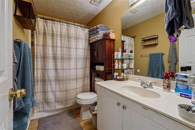 bathroom featuring visible vents, toilet, curtained shower, a textured ceiling, and vanity