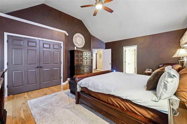 bedroom with lofted ceiling, ceiling fan, and light wood finished floors