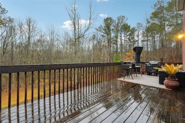 deck with outdoor dining area