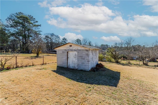 view of shed featuring fence