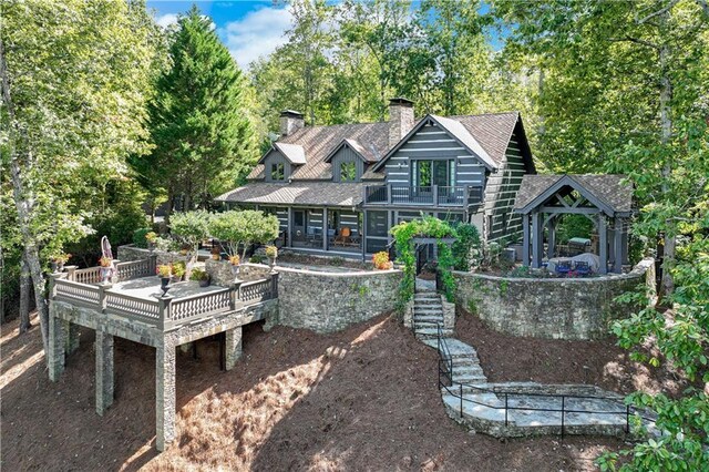 3464 Carolyn St, Gainesville, GA 30504 - back of house featuring a chimney, stairs, a deck, a shingled roof, and view of wooded area