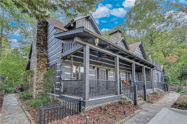 3464 Carolyn St, Gainesville, GA 30504 - view of front of home with a porch, a chimney, a ceiling fan, and board and batten siding