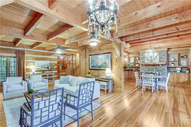 3464 Carolyn St, Gainesville, GA 30504 - living room with a chandelier, wood ceiling, beamed ceiling, wood-type flooring, and wooden walls