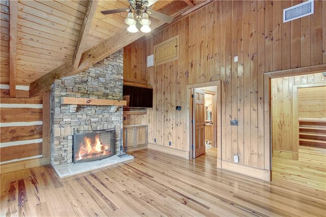 3464 Carolyn St, Gainesville, GA 30504 - unfurnished living room featuring wooden ceiling, beam ceiling, a fireplace, wood finished floors, and a ceiling fan