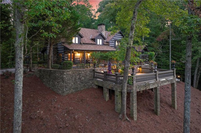 3464 Carolyn St, Gainesville, GA 30504 - back of property at dusk with a chimney and a deck