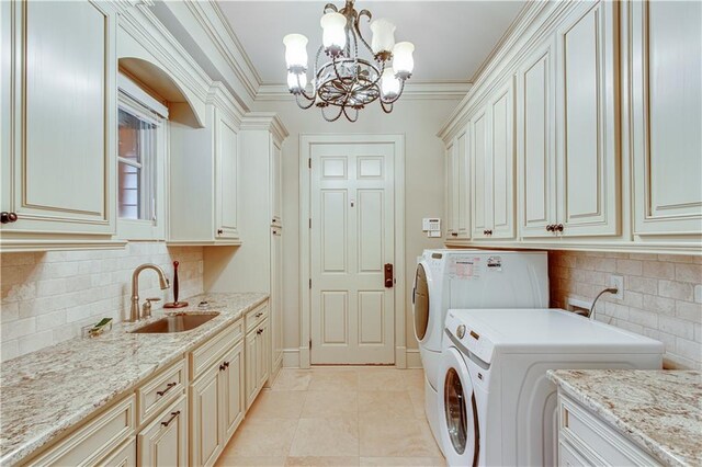 3464 Carolyn St, Gainesville, GA 30504 - clothes washing area with cabinet space, washer and dryer, a chandelier, and ornamental molding