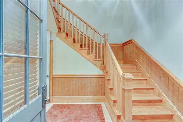 3464 Carolyn St, Gainesville, GA 30504 - stairway featuring a wainscoted wall and wood walls
