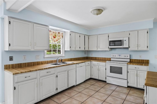 1229 Colony Cir, Marietta, GA 30068 - kitchen featuring white appliances, white cabinets, light tile patterned floors, and ornamental molding