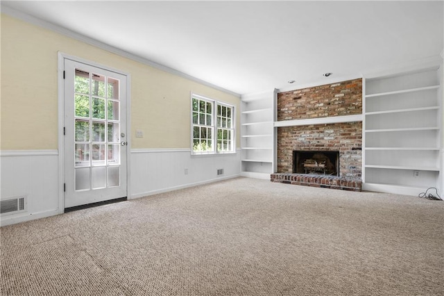 1229 Colony Cir, Marietta, GA 30068 - unfurnished living room with ornamental molding, plenty of natural light, wainscoting, built in features, and carpet floors