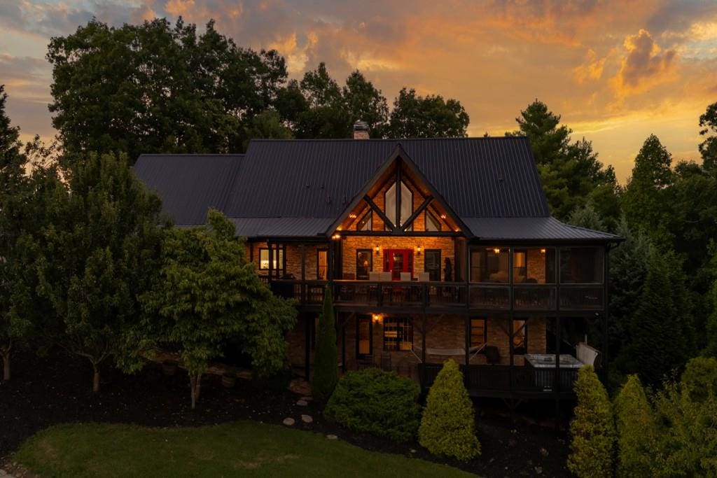 view of back house at dusk