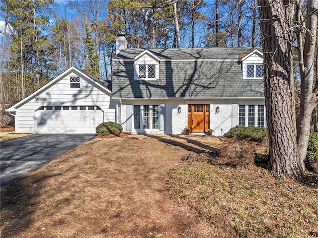 cape cod house with a garage