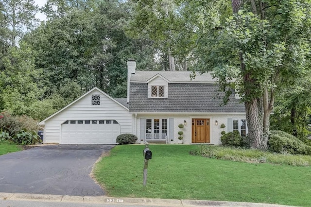 5371 Tall Oak Dr, Marietta, GA 30068 - view of front of property with a front lawn, aphalt driveway, a chimney, a shingled roof, and an attached garage
