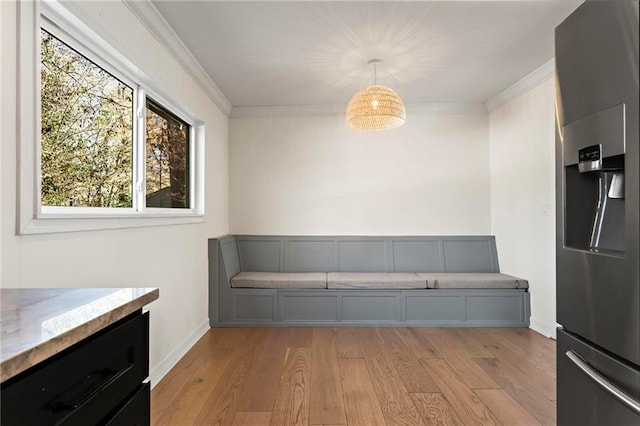 5371 Tall Oak Dr, Marietta, GA 30068 - unfurnished dining area with light wood-type flooring, baseboards, and crown molding